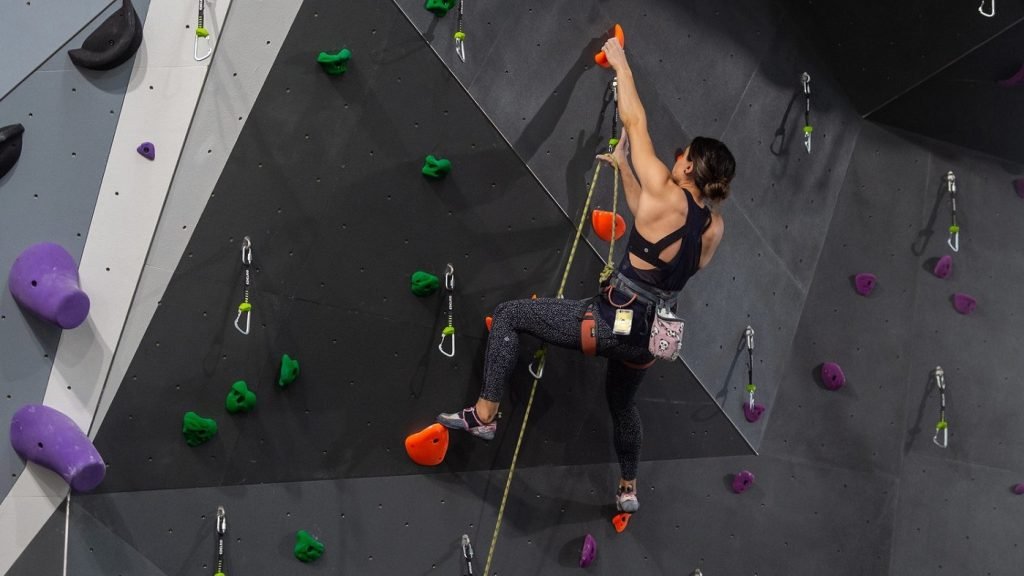progression of rock climbing - lead climbing in gym