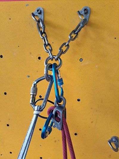 Steps to set up a direct belay - Make a bight of rope with the climber's end at the top and slot it into the belay device and clip the bight with a locking carabiner 