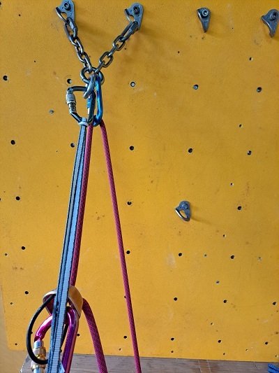 Steps to set up a redirect belay - Clip the belayer's rope into your belay device at your harness belay loop